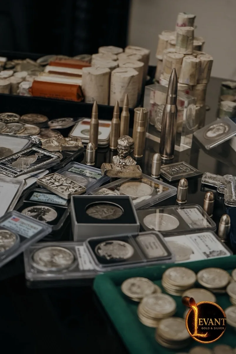 Mixed gold coins, bars, and slabs